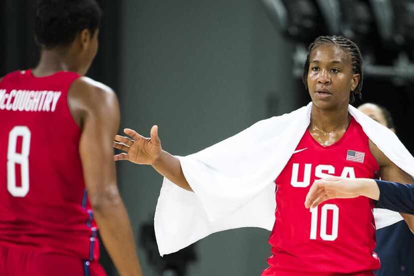 Tamika Catchings (10) of United States high fives teammate Angel Mccoughtry (8) during a...
