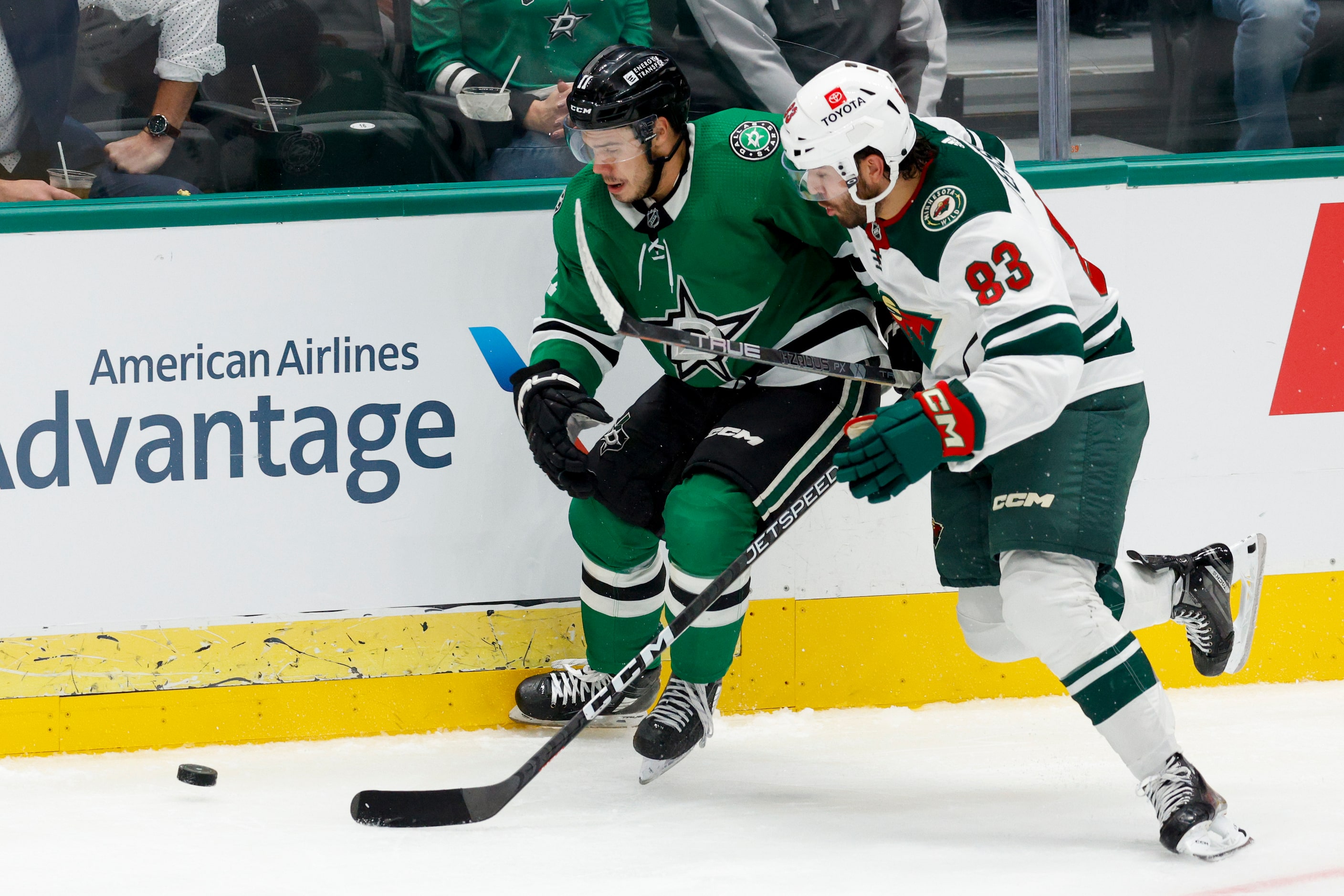 Dallas Stars center Logan Stankoven (11) and Minnesota Wild forward Joel Teasdale (83)...