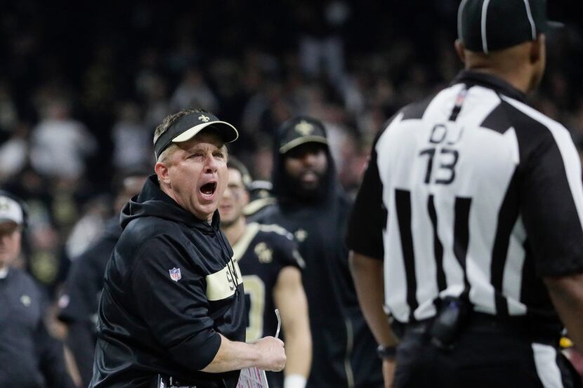 New Orleans Saints coach Sean Payton screams at down judge Patrick Turner after no penalty...