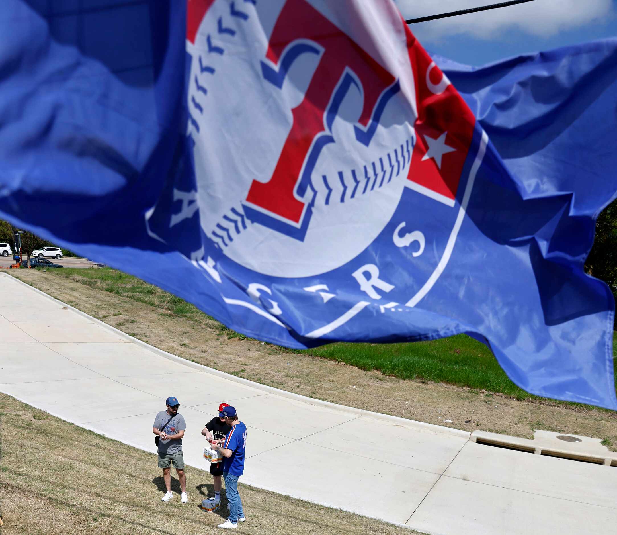 Texas Rangers fans hangout before Opening Day at a tailgate party outside of Globe Life...