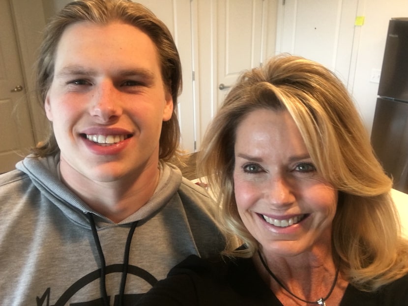 Gerrit Choate takes a photo with his mother, Fifi Choate.