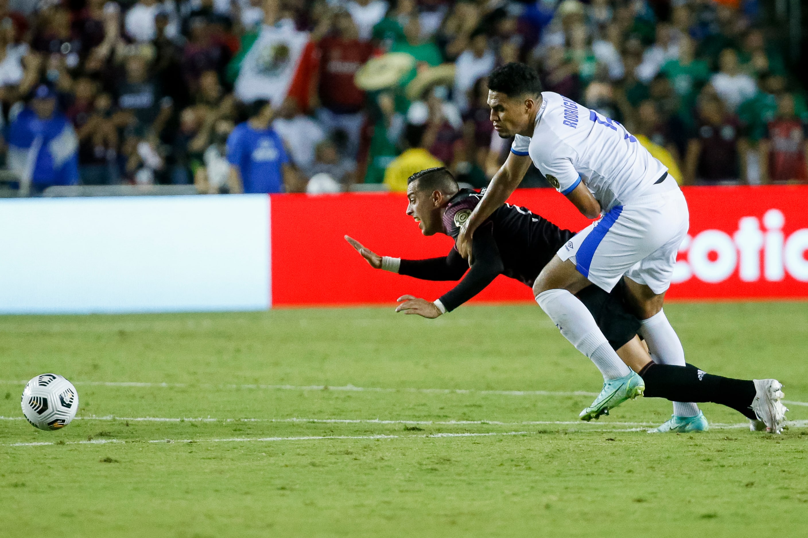 El Salvador defender Ronald Gomez (5) tackles Mexico forward Rogelio Funes Mori (11) during...