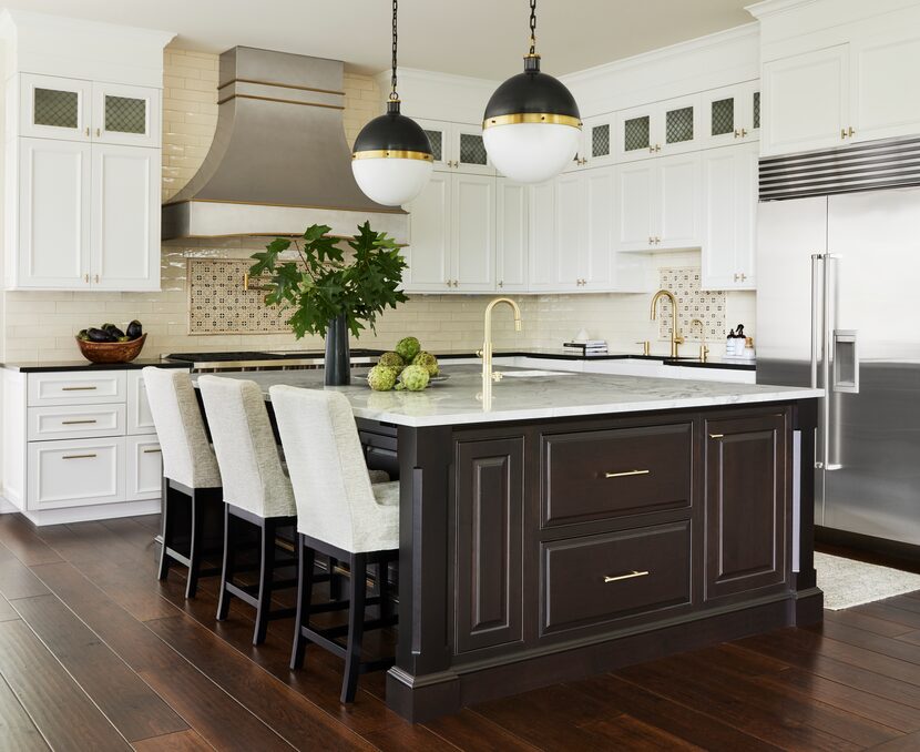 A kitchen has mixed metals in its design.