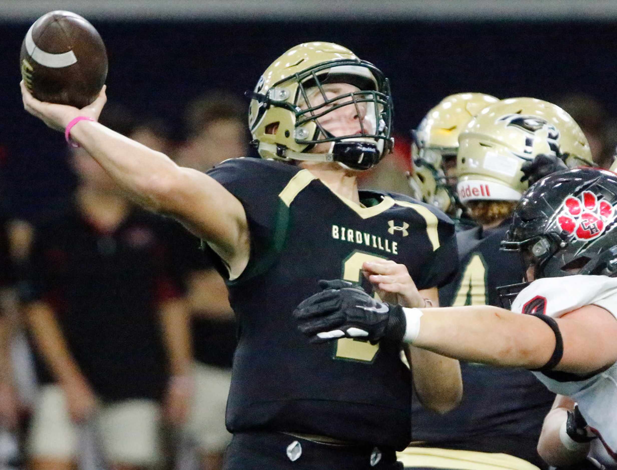 Birdville High School quarterback Stone Earle (3) throws a pass during the first half as...