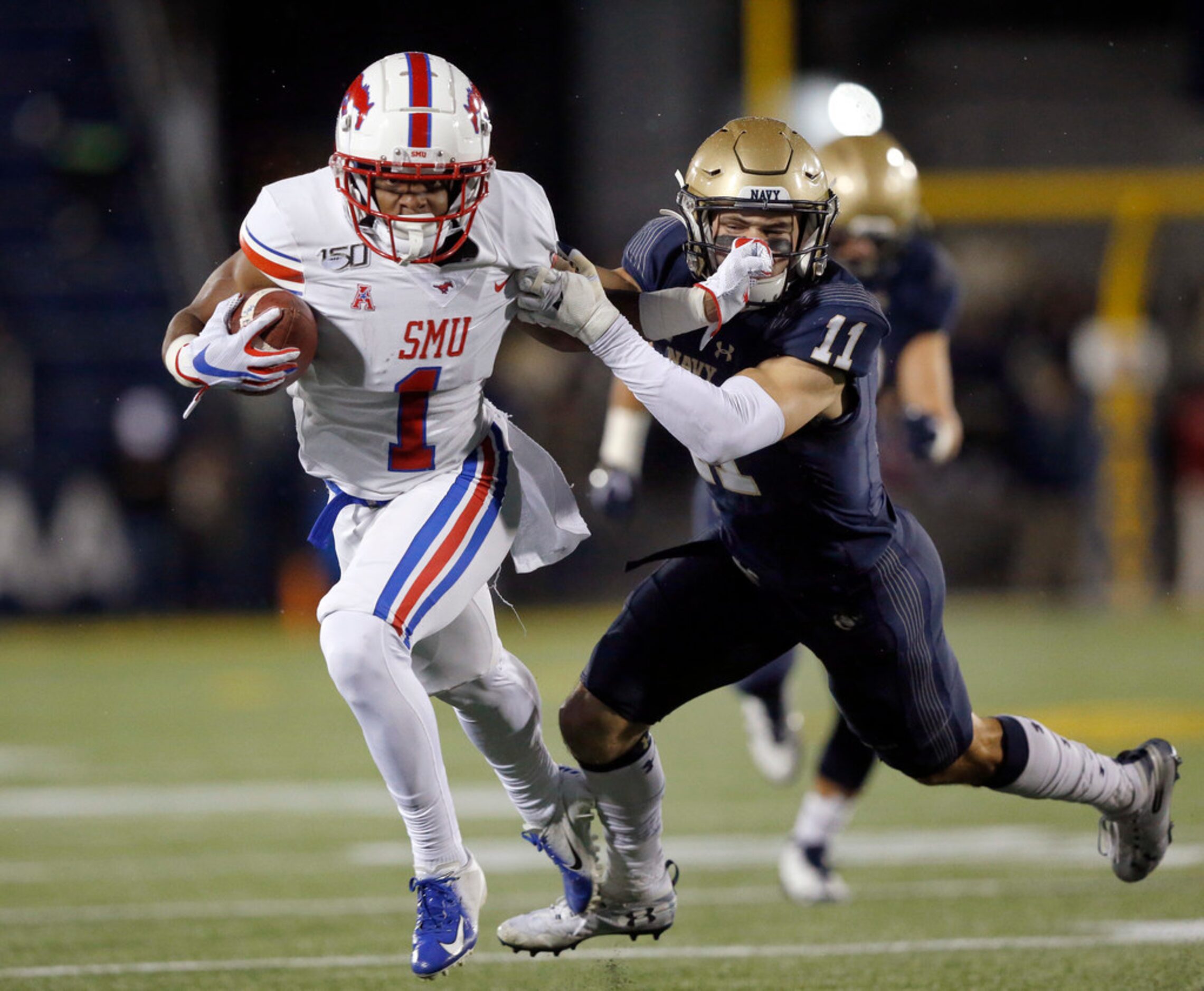 Southern Methodist Mustangs wide receiver CJ Sanders (1) gives Navy Midshipmen safety Evan...