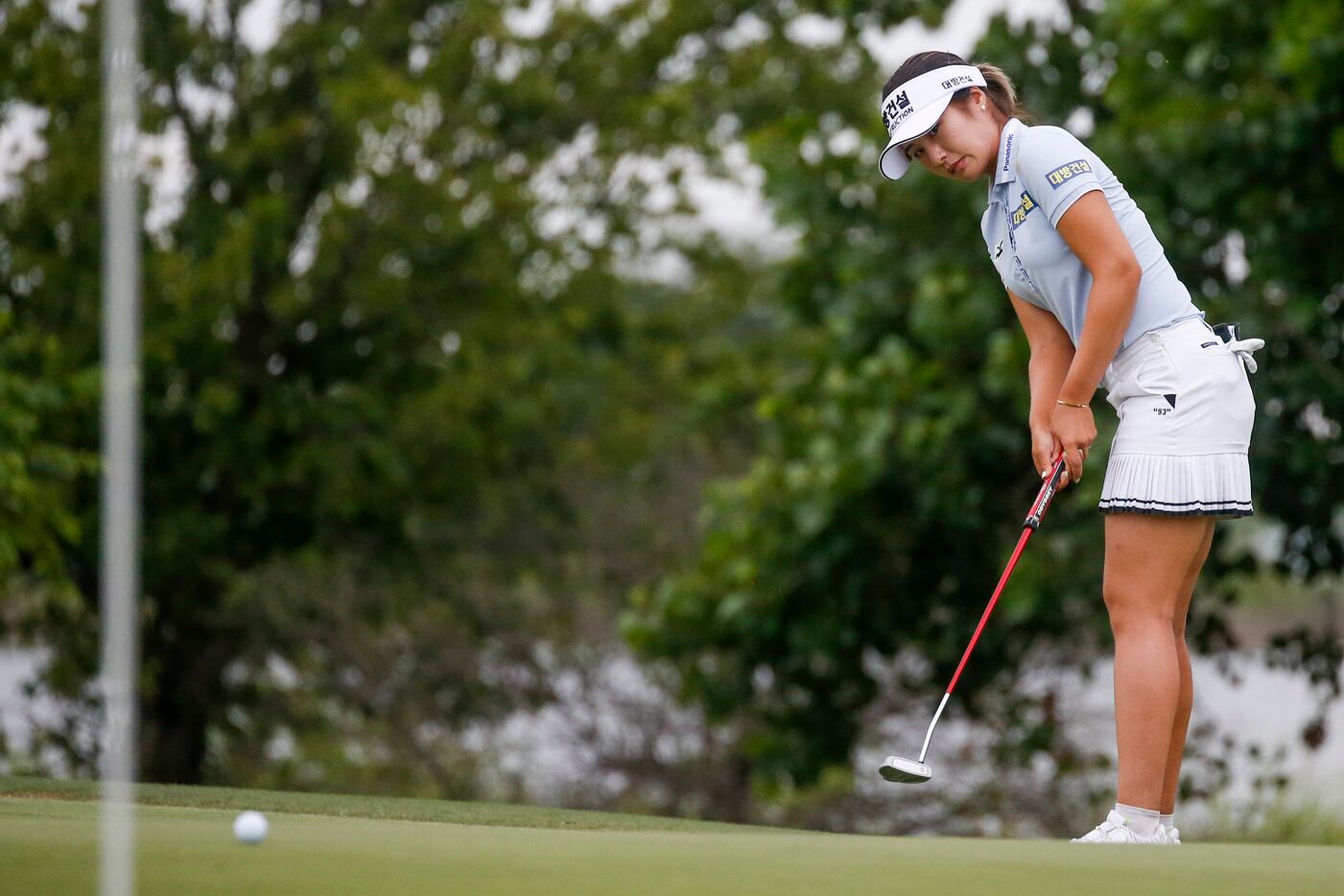 Professional golfer Jeongeun Lee6 putts a ball on the No. 12 green during the third round of...