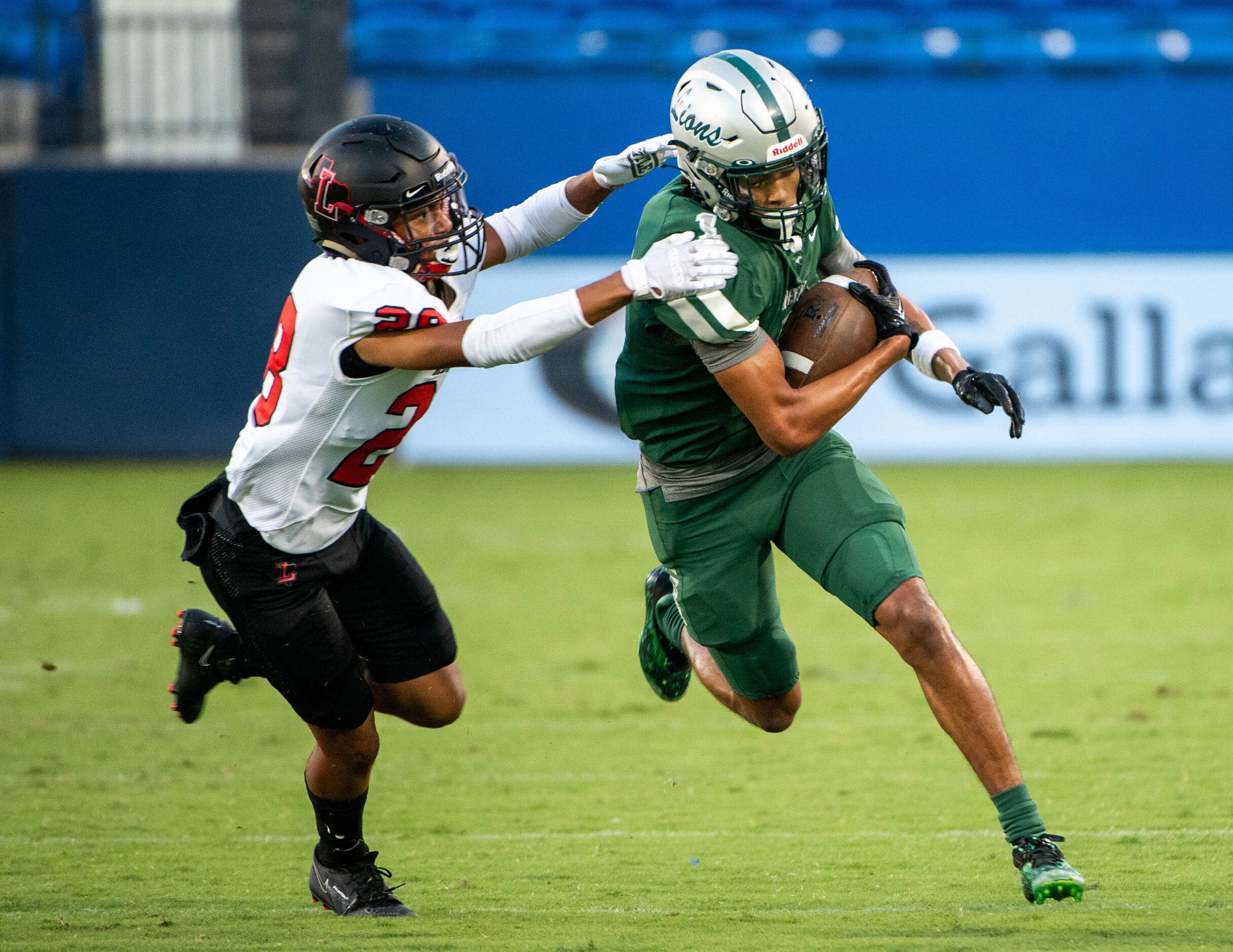 Frisco Reedy's wide receiver Kaleb Smith (1) runs through a tackle attempt by Frisco...