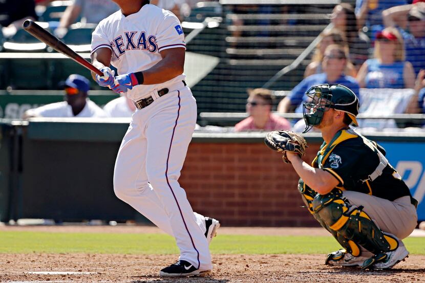 Texas Rangers third baseman Adrian Beltre watches his three-run home run during the fifth...
