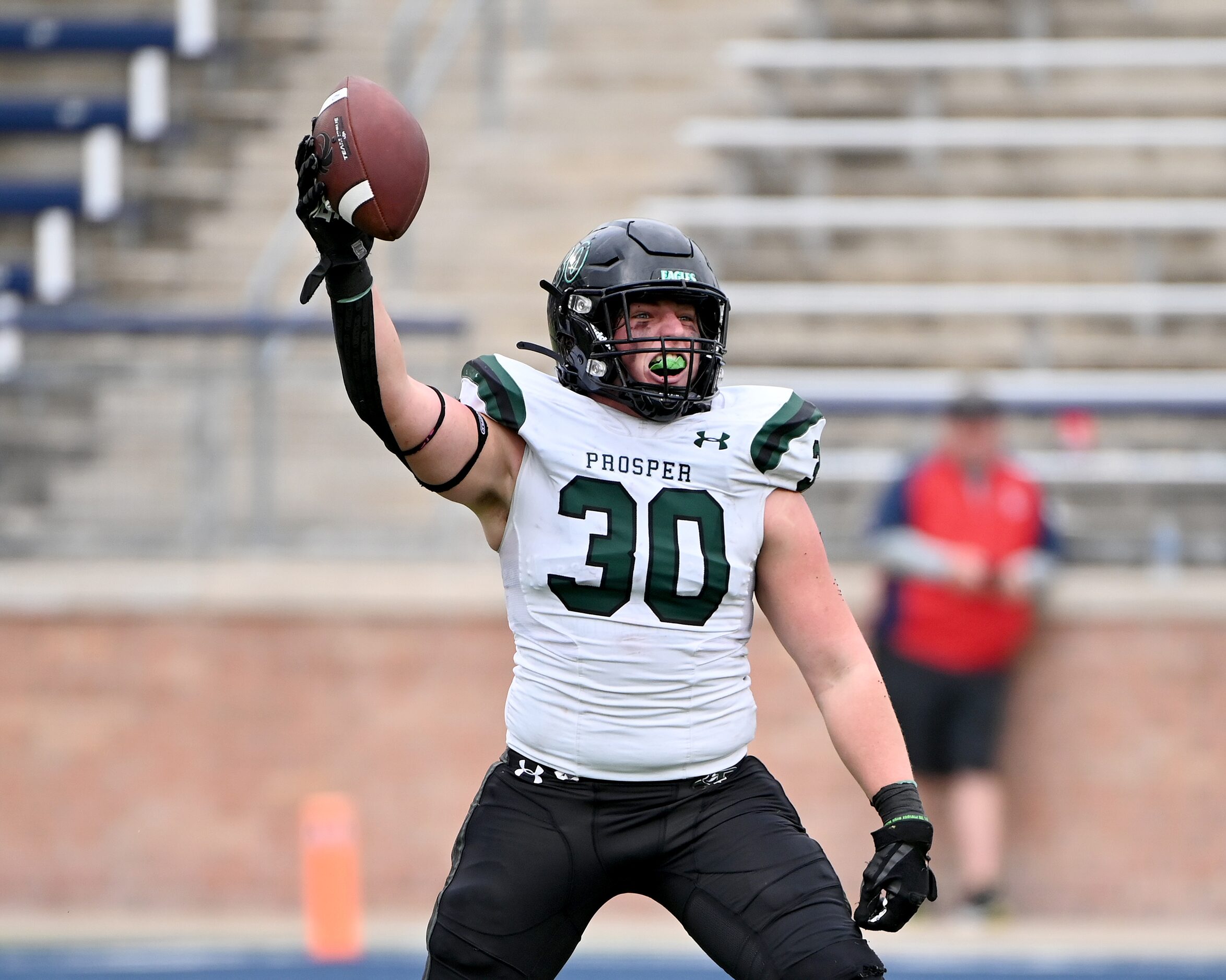 Prosper's Davis Perkins (30) celebrates after a fumble recovery in the first half of a Class...