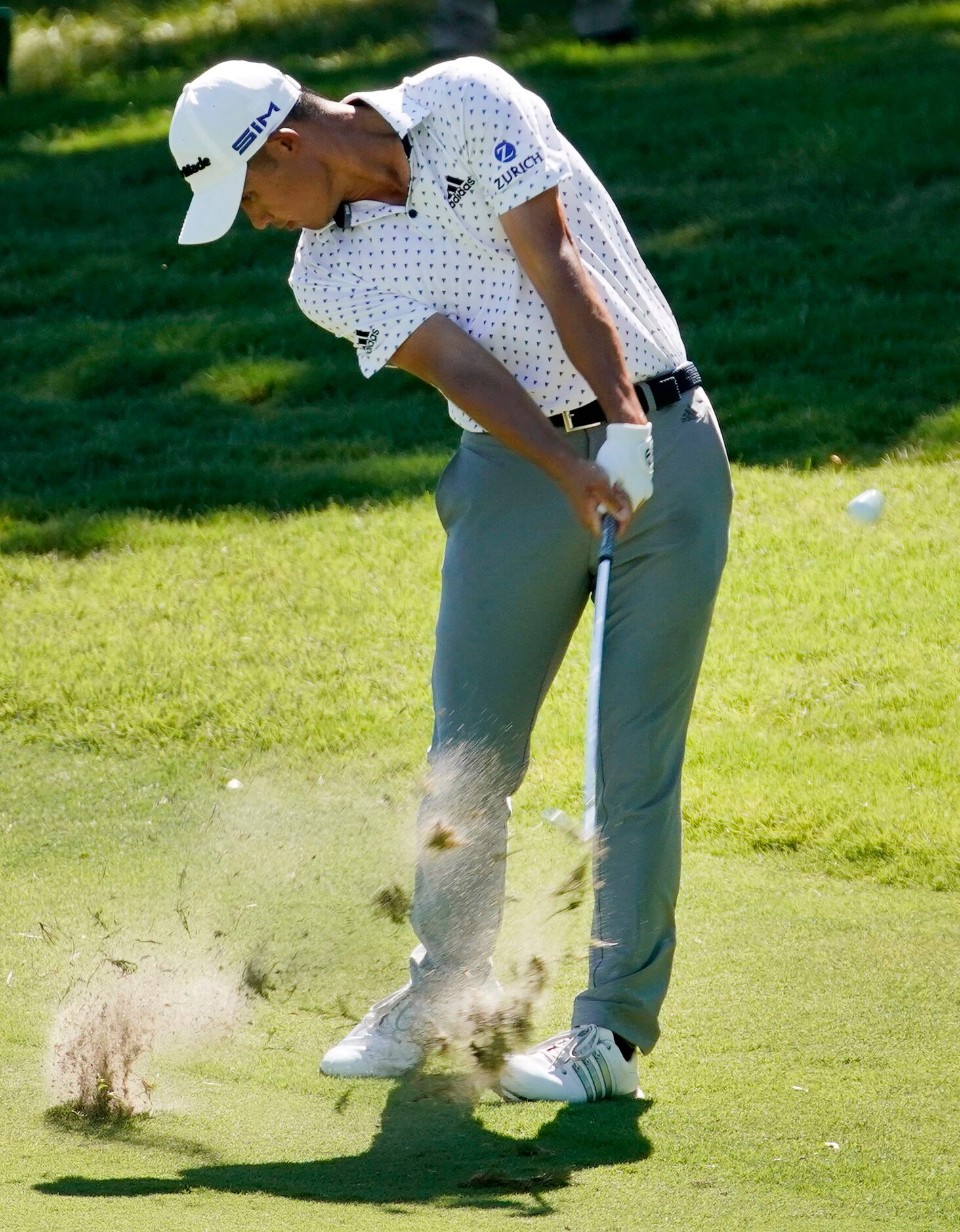 PGA Tour golfer Collin Morikawa makes his approach shot on No. 18 during the final round of...