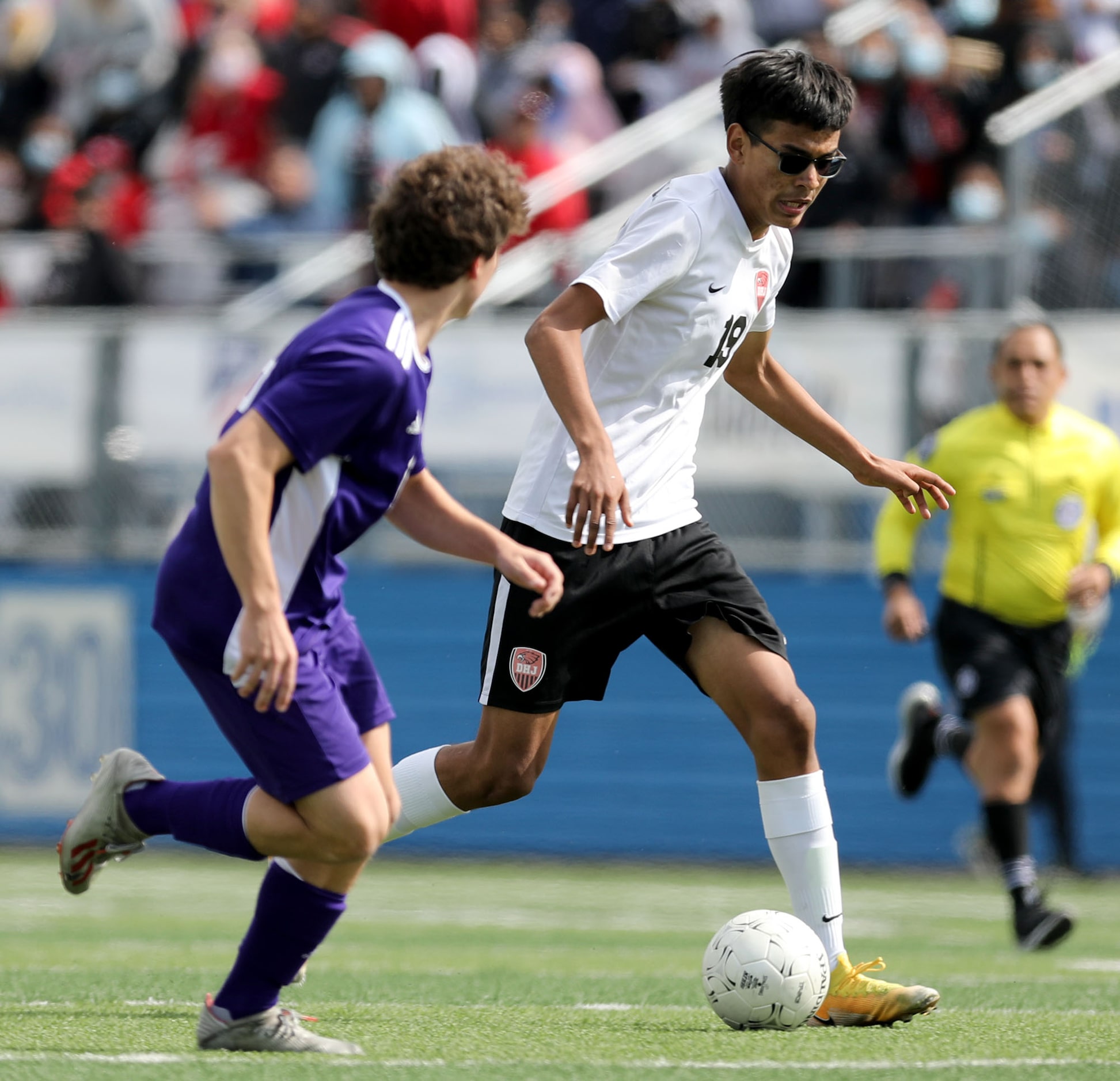 Fort Worth Diamond Hill-Jarvis' (19) looks for room around a Boerne player during their UIL...