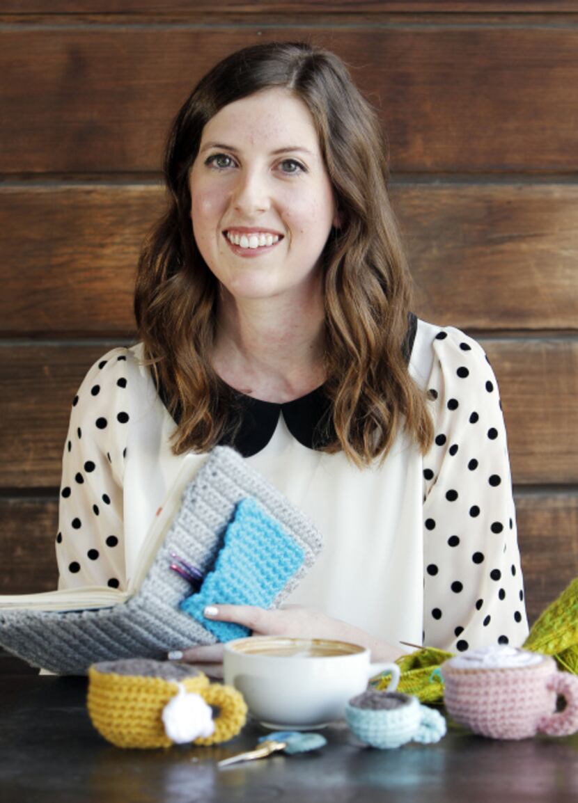 Meredith Crawford poses for a portrait with a daily planner with a crocheted cover at The...