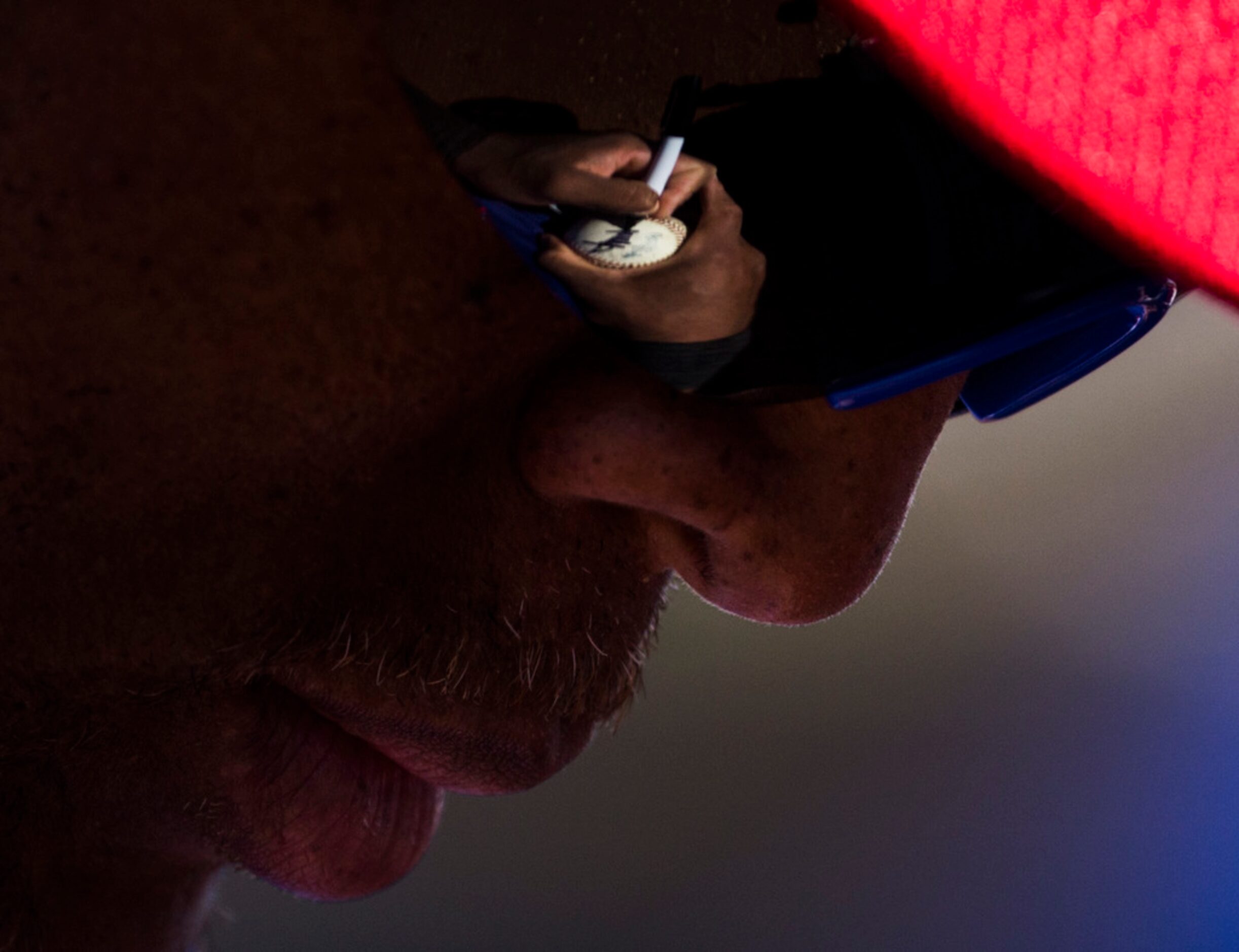 Texas Rangers third baseman Adrian Beltre (29) signs a baseball for a fan before a spring...