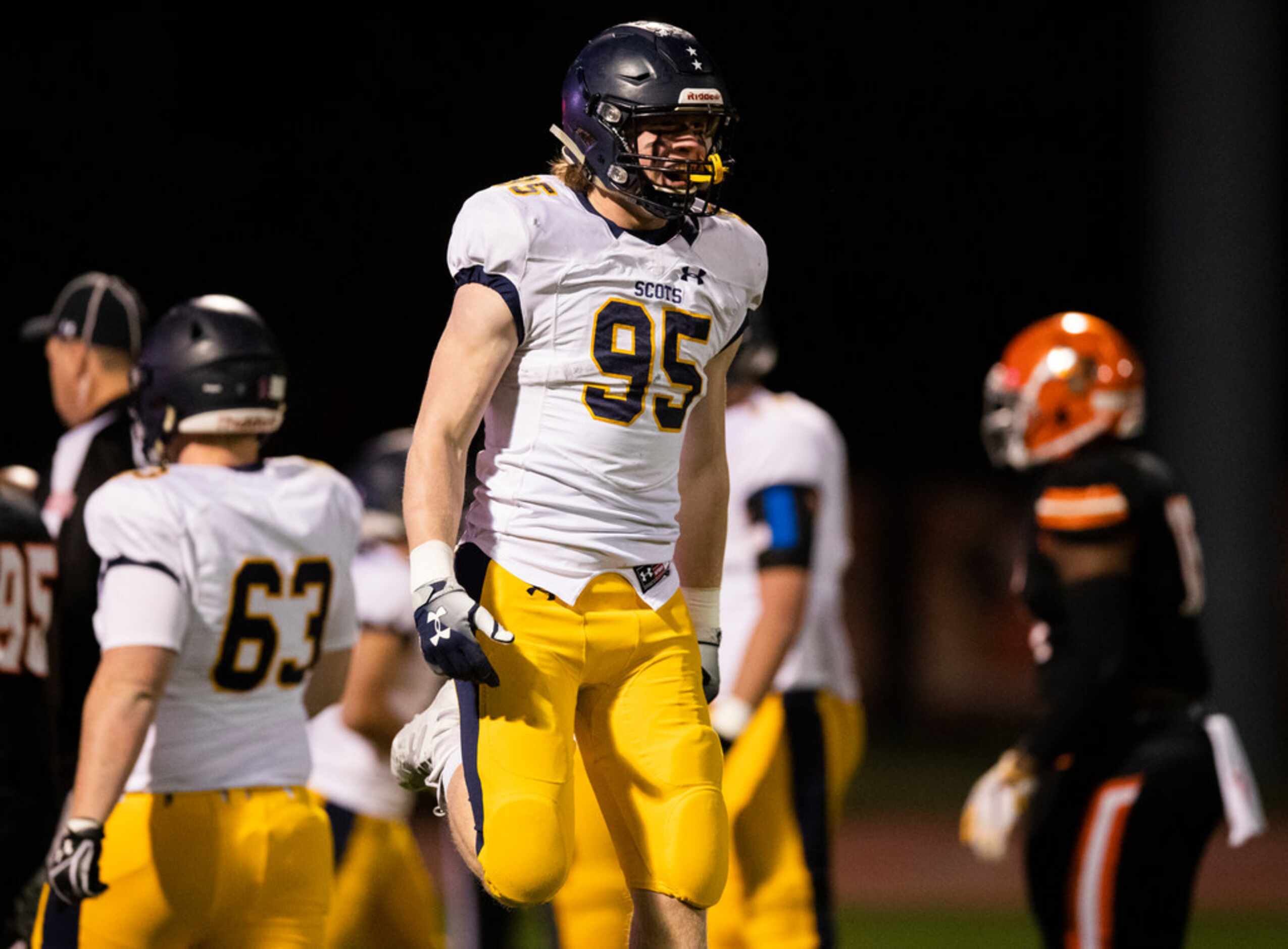 Highland Park's Jack Curtis (95) celebrates a touchdown during the first quarter of a...