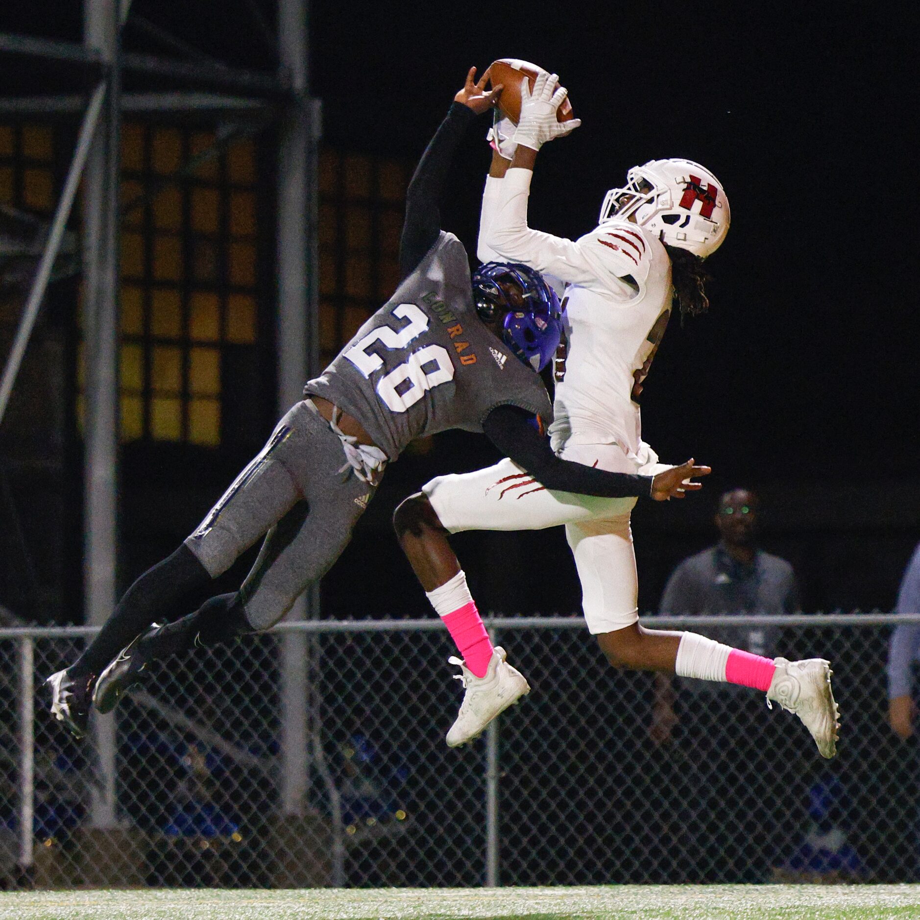 Hillcrest wide receiver Adian Lewis (21) makes a leaping catch for a touchdown over Conrad...