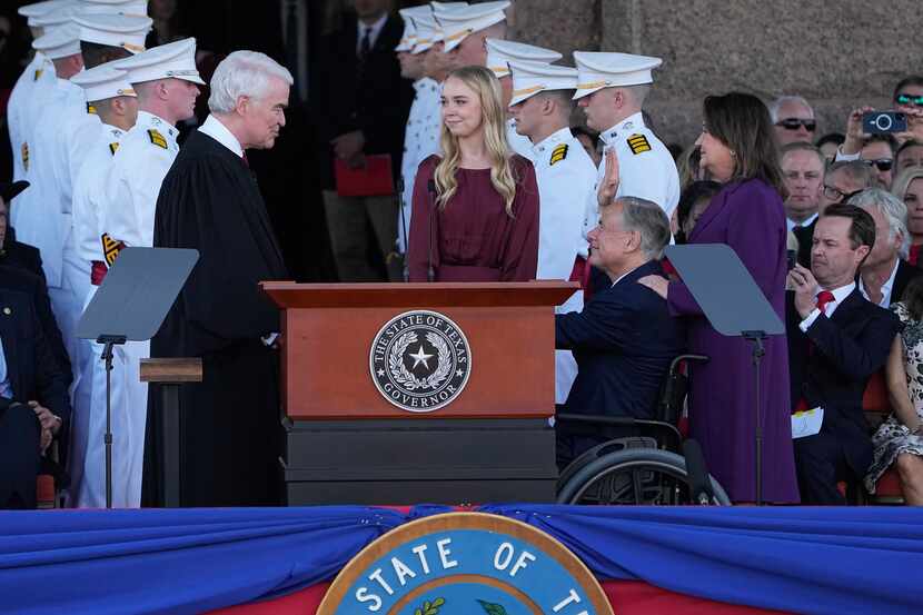 Texas Gov. Greg Abbott, second from right, stands with his wife Cecilia, right, and daughter...