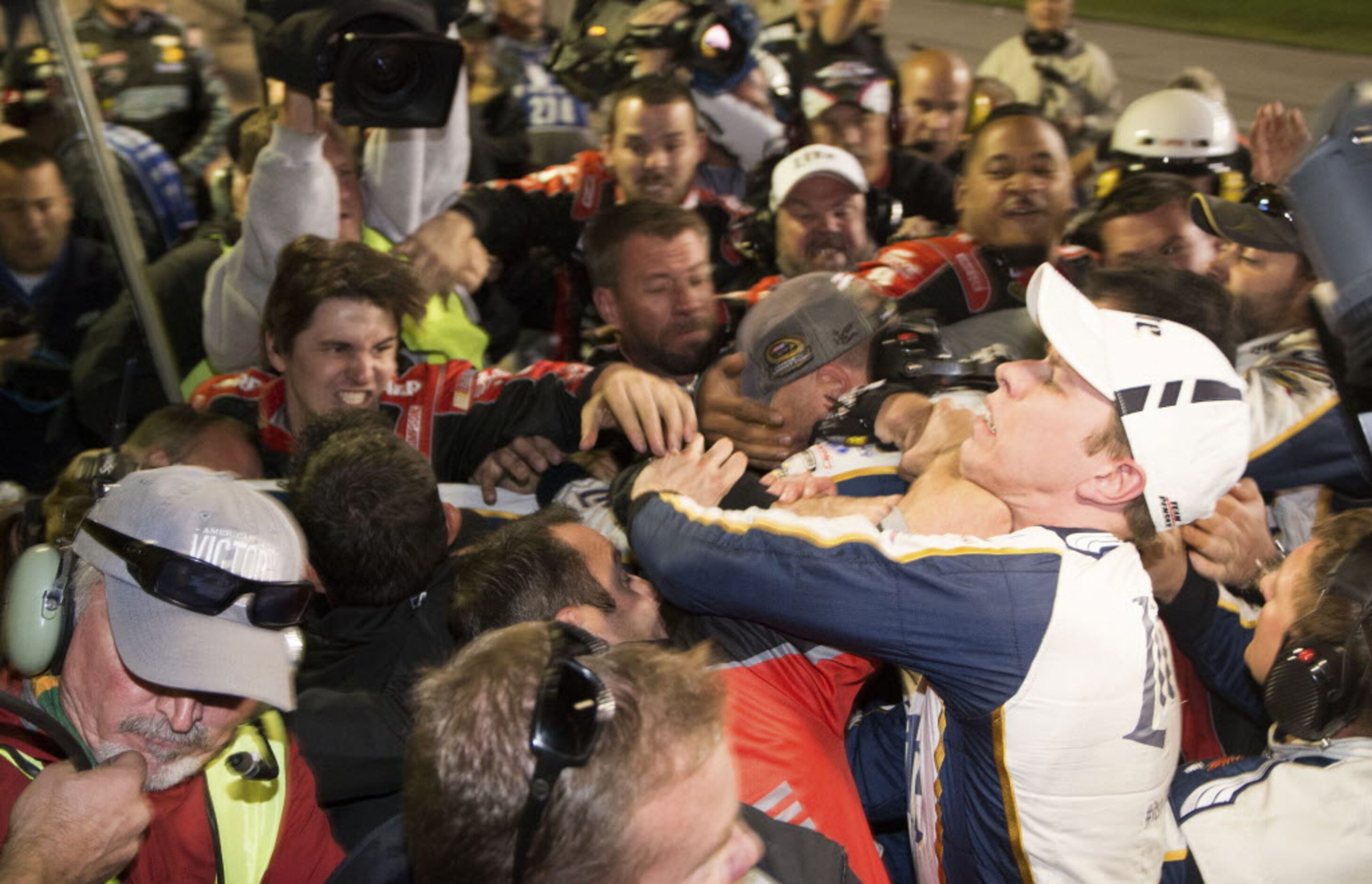 Brad Keselowski, right, is punched during a fight after the NASCAR Sprint Cup Series auto...