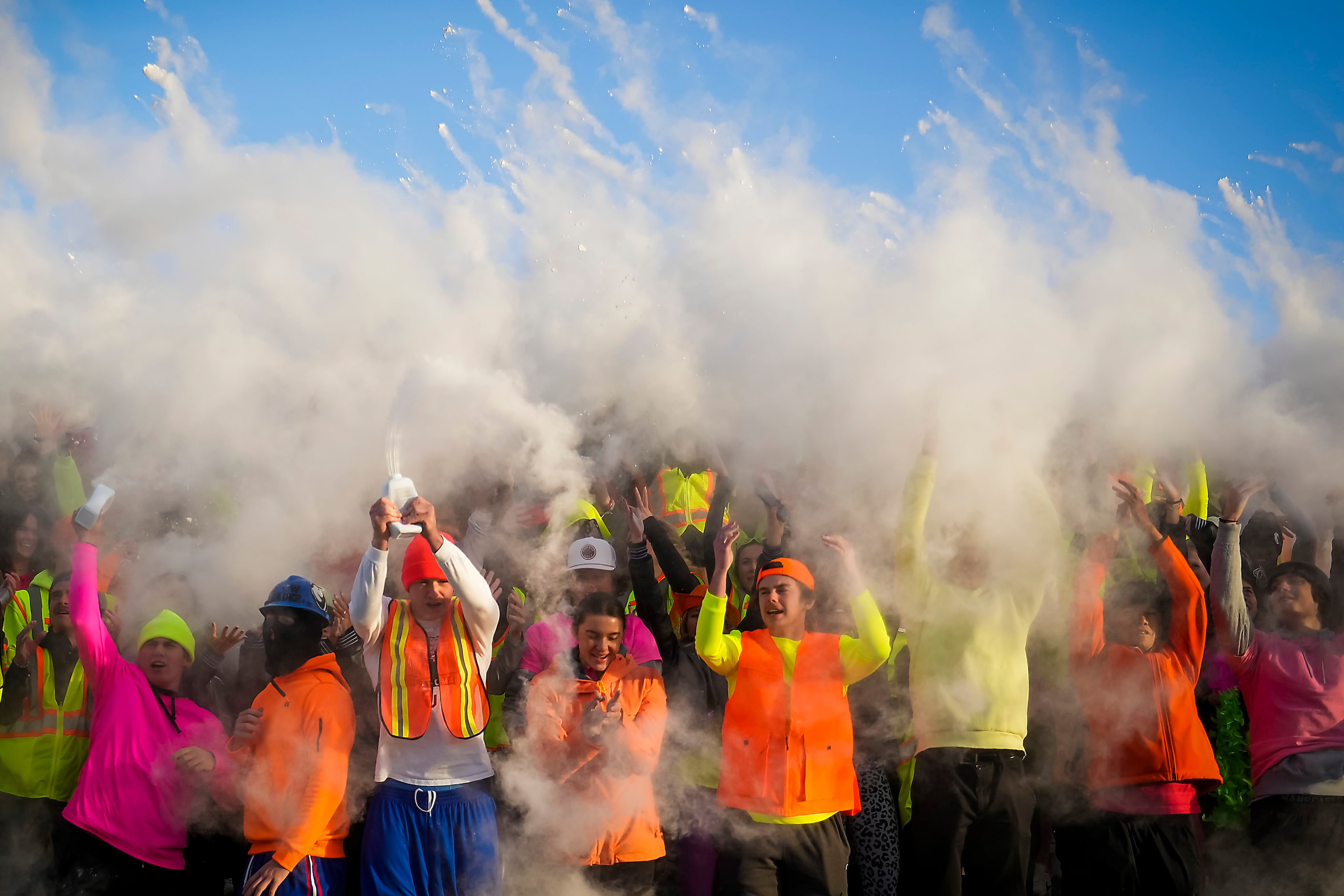 The Denton Guyer student section celebrates in a cloud of baby powder during the second half...