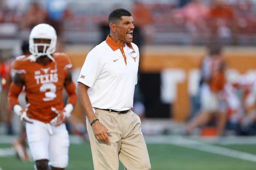 Texas assistant coach Jay Norvell yells instructions against Rice at Royal-Memorial Stadium...