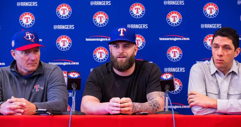 First baseman Mike Napoli, center, speaks during a press conference announcing that Napoli...