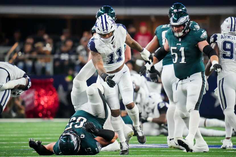 Dallas Cowboys linebacker Micah Parsons (11) pushes down Philadelphia Eagles offensive...