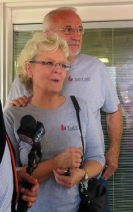  Dick and Betty Odgaard emerge from the WHO radio studio at the Iowa State Fair after...