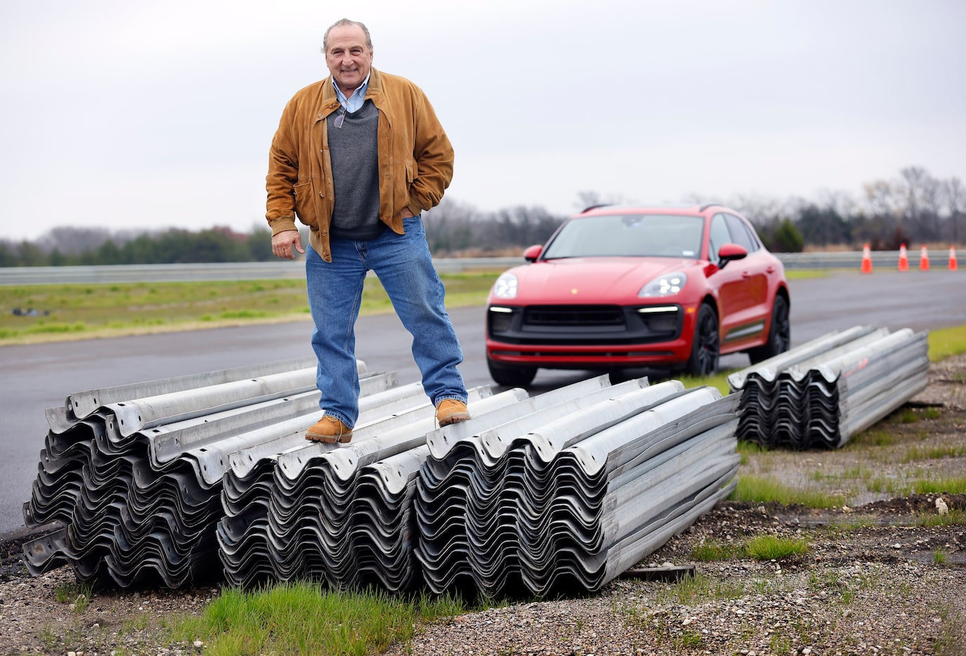 Lou Gigliotti, three-time National Champion World Challenge driver, poses on a stack of...