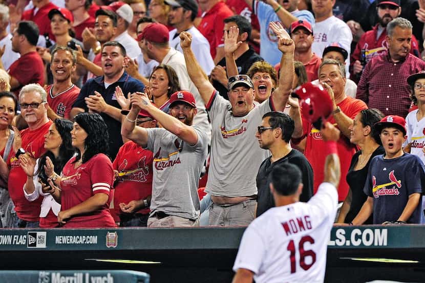 
The St. Louis Cardinals’ Kolten Wong soaks in the love from fans during a game at Busch...