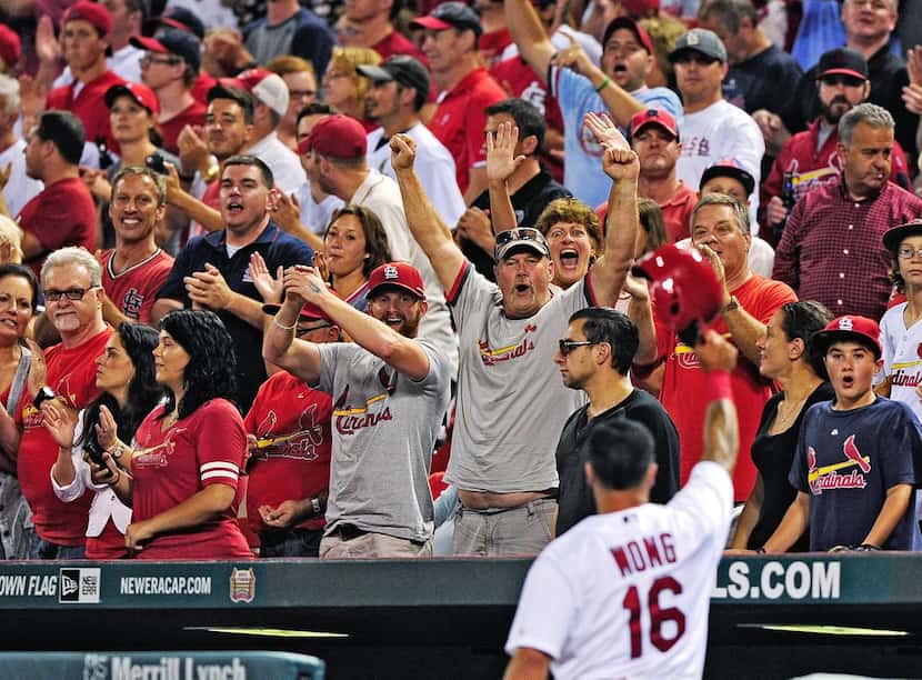 
The St. Louis Cardinals’ Kolten Wong soaks in the love from fans during a game at Busch...