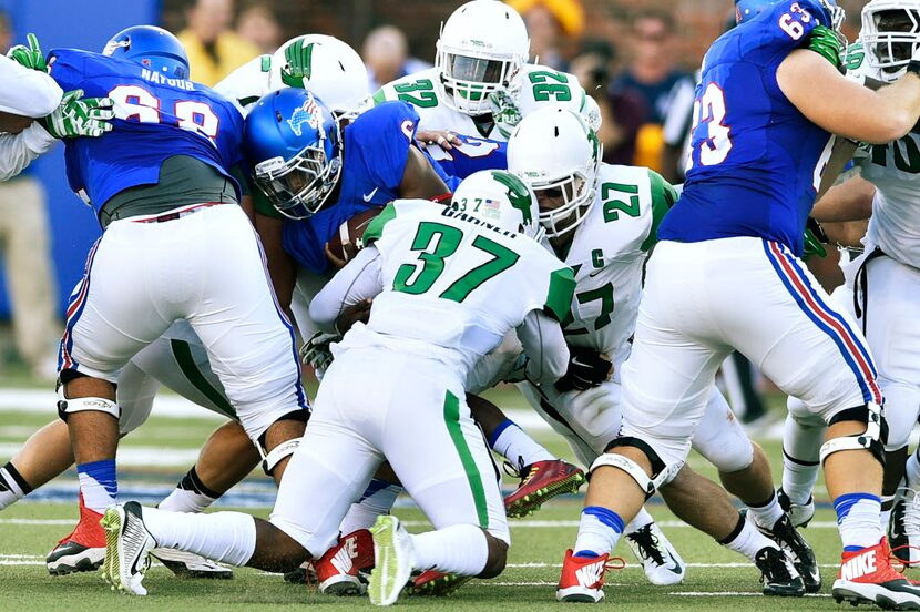 North Texas freshman linebacker Brandon Garner (37) brings down SMU freshman running back...