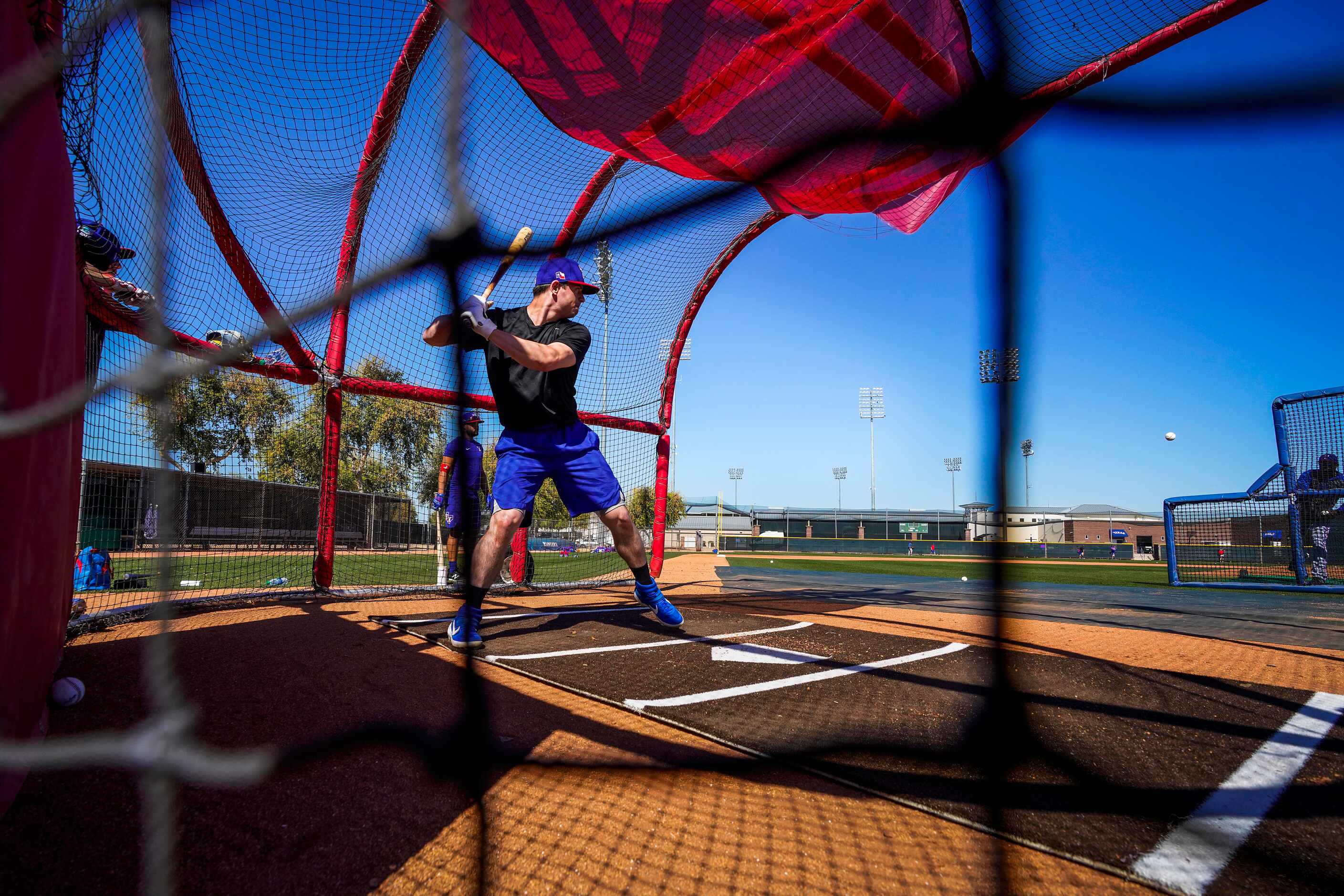 Texas Rangers infielder Nick Solak takes batting practice during a spring training workout...