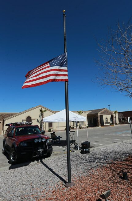  The U.S. flag flies at half-staff outside the Sunset Funeral Home, Sunday Feb. 14, 2016 in...