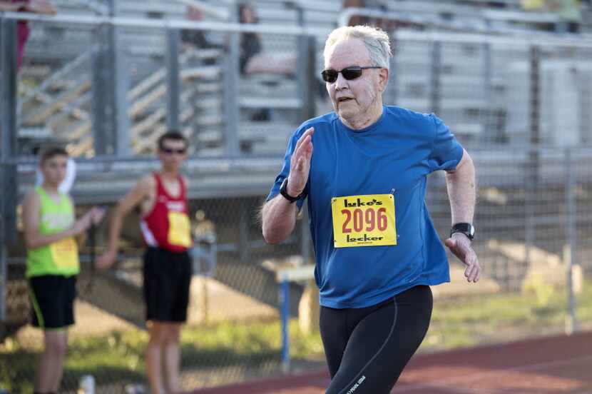 Joe Vaughan, 84, competes in the 100-meter race in the Luke's Locker All-Comers Track Meet...