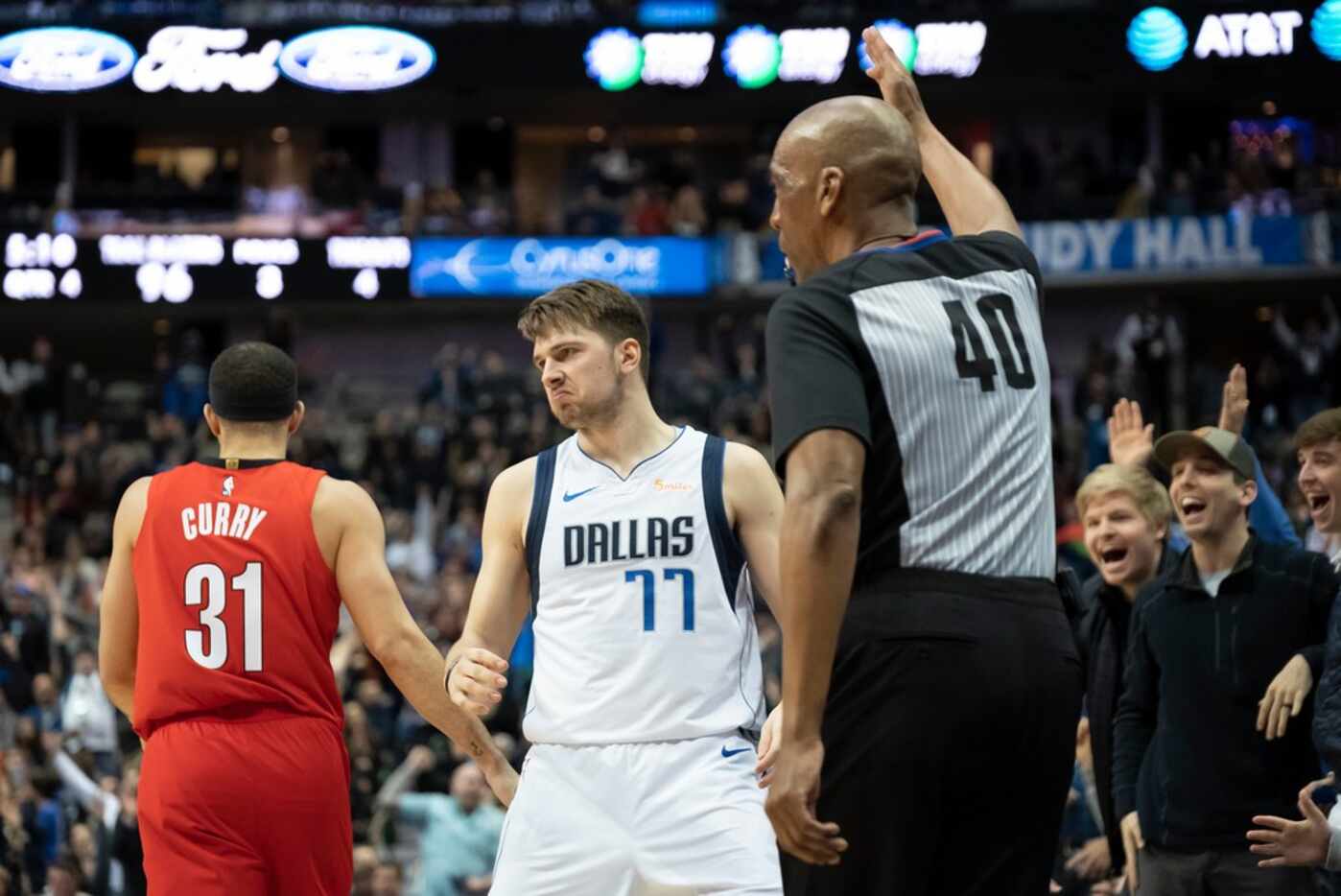 Dallas Mavericks forward Luka Doncic (77) celebrates a 3-pointer past Portland Trail Blazers...