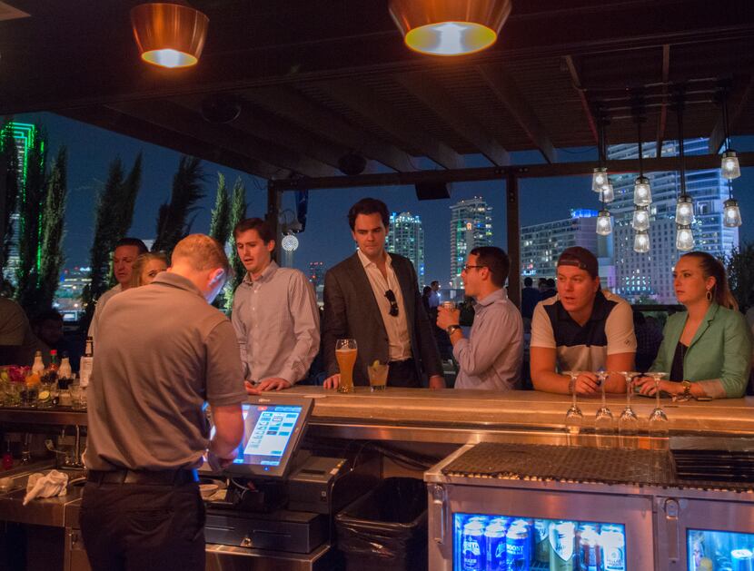 The 12,000-square-foot Happiest Hour features  a first-floor patio with backyard-style...