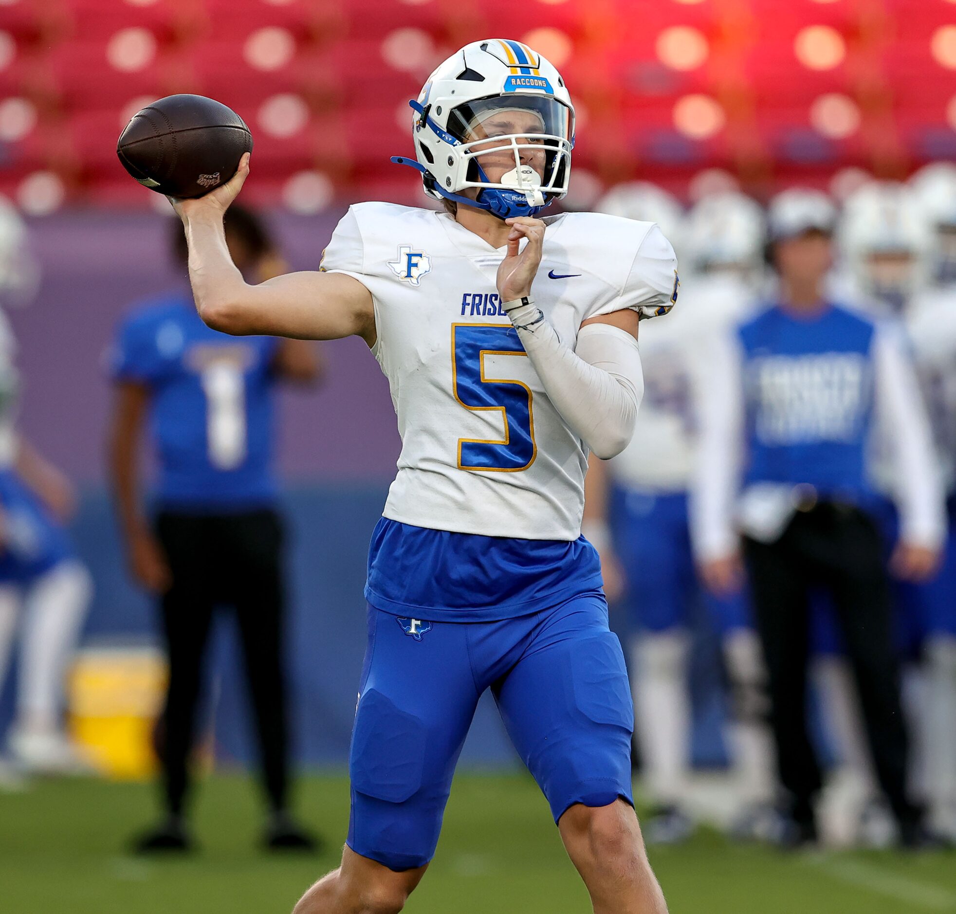 Frisco quarterback Cobyn Harbert attempts a pass against Frisco Heritage during the first...