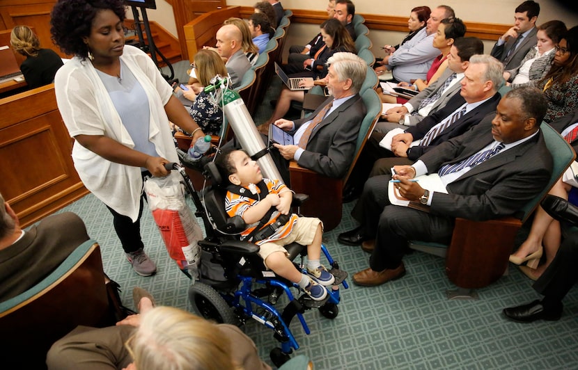 Mesquite mother Linda Badawo (left) pushed her medically fragile son, D'ashon Morris, past...