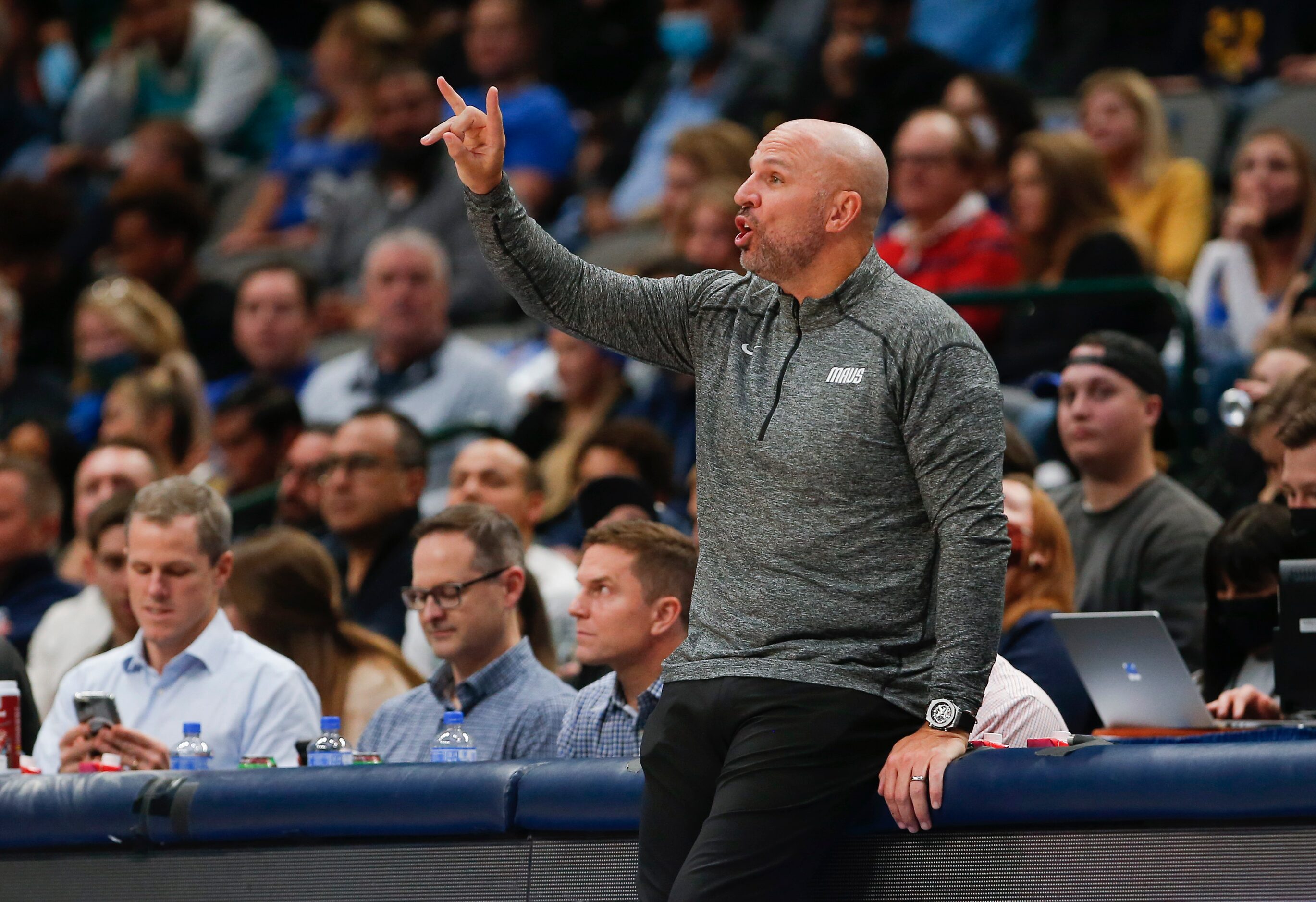 Dallas Mavericks head coach Jason Kidd signals his team during the second half of an NBA...