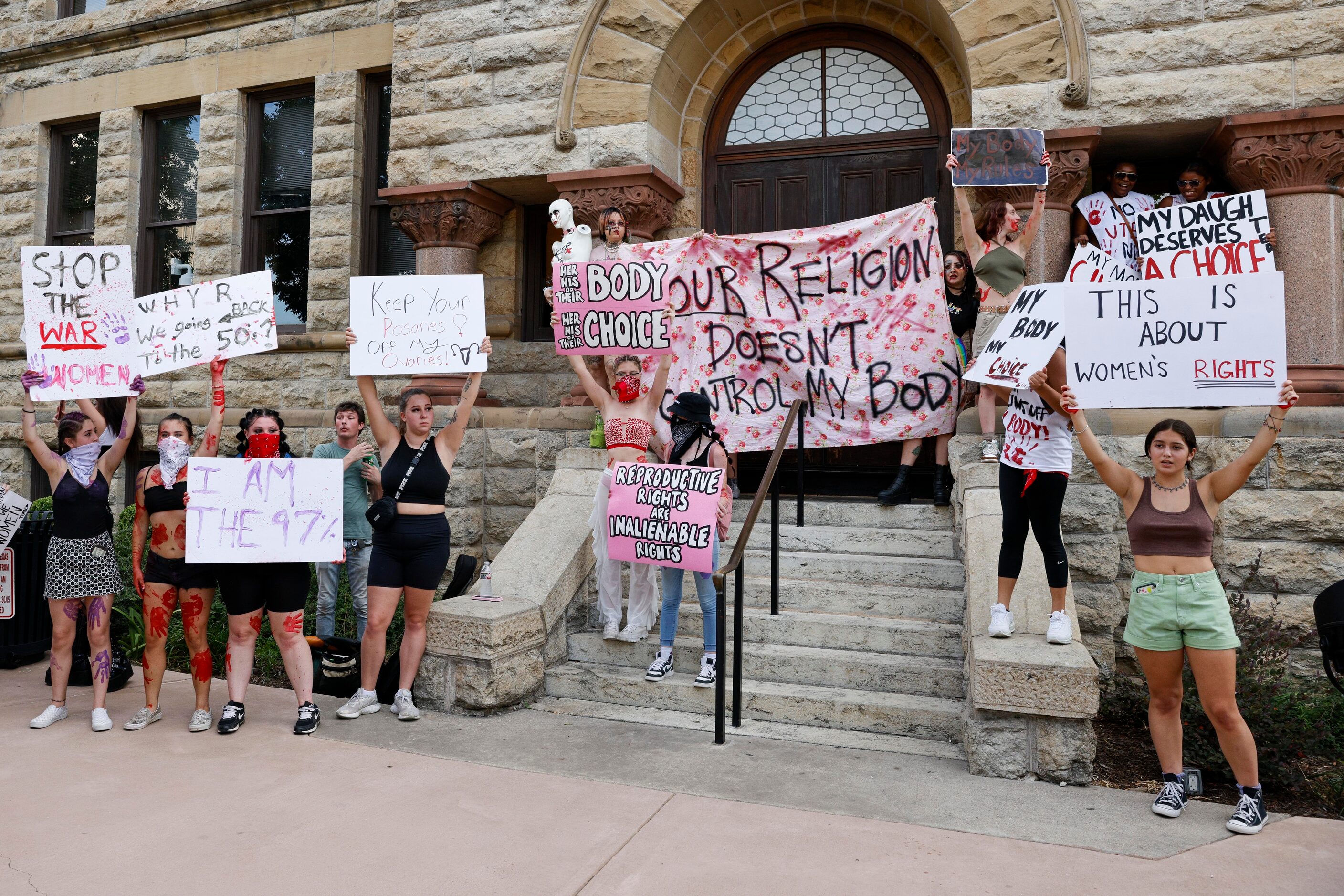 Abortion rights supporters gather outside the old Denton County Courthouse in Denton, Texas,...