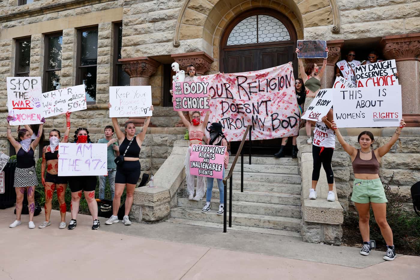 Abortion rights supporters gather outside the old Denton County Courthouse in Denton, Texas,...