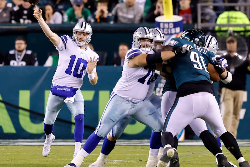 Dallas Cowboys quarterback Cooper Rush (10) throws a second quarter pass which was tipped...