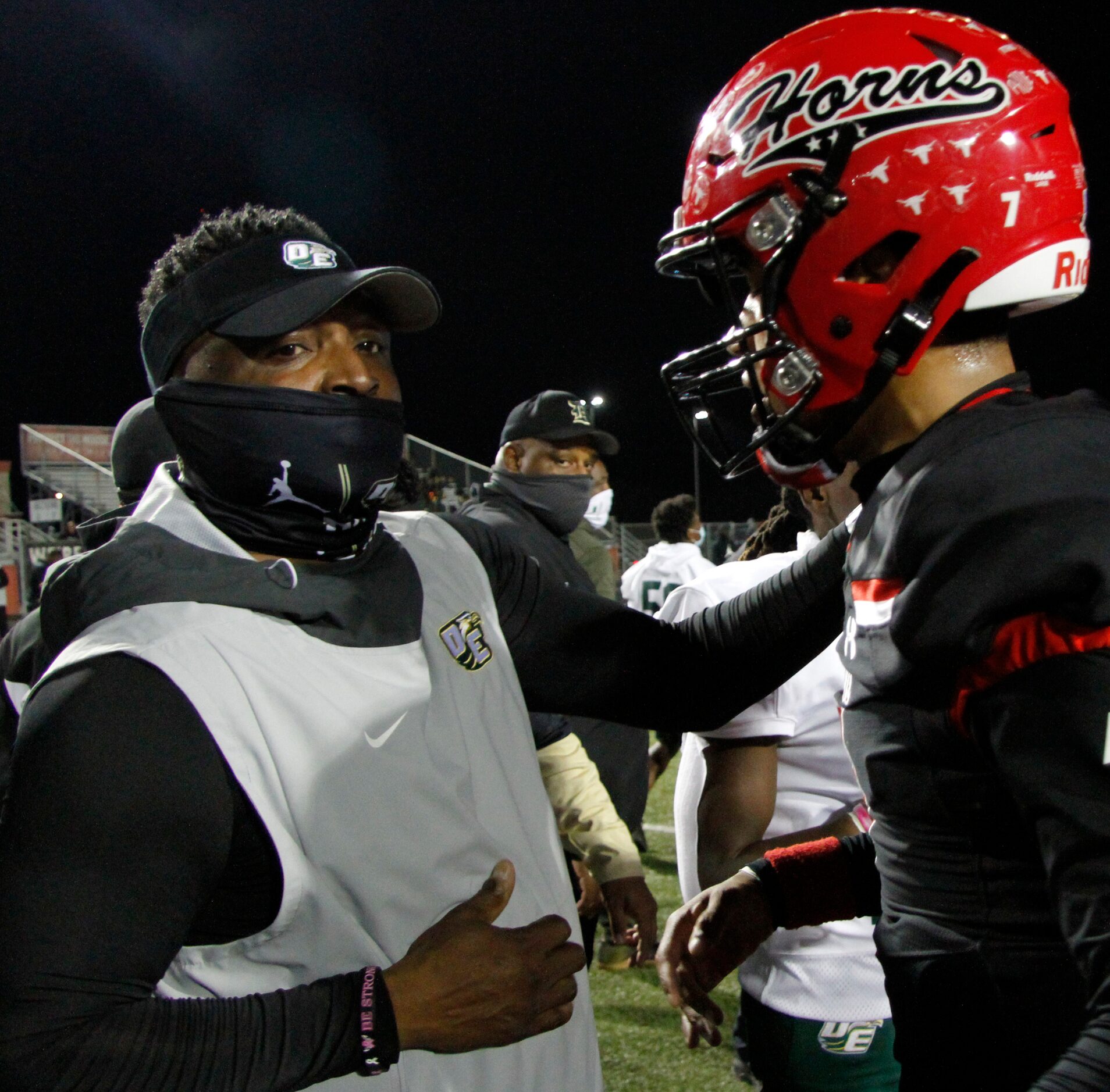 In a show of class, DeSoto head coach Claude Mathis sought out Cedar Hill quarterback Kaidon...