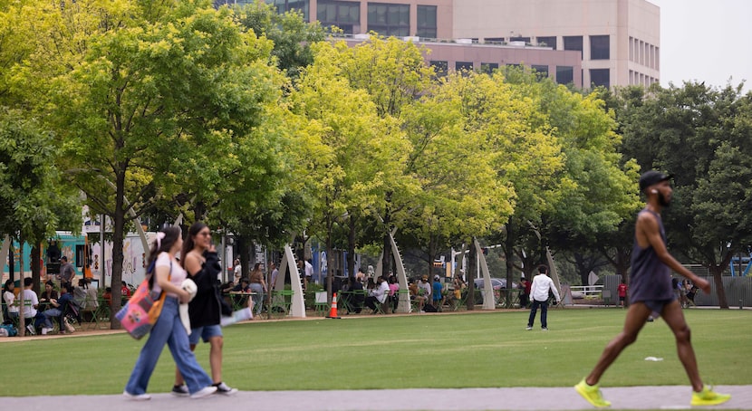 People walk through Klyde Warren Park on Friday, May 24, 2024, in Dallas. 