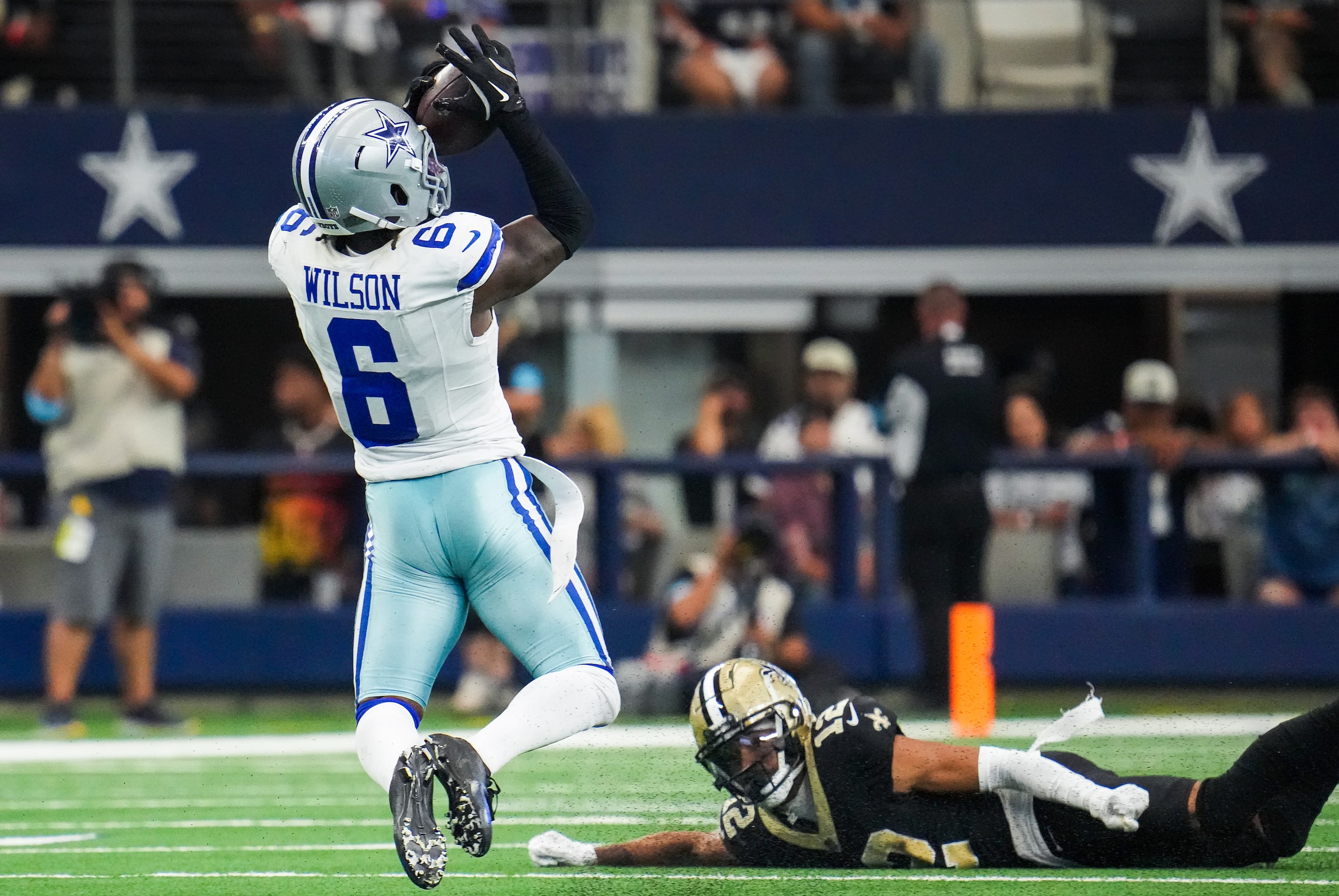 Dallas Cowboys safety Donovan Wilson (6) intercepts a pass intended for New Orleans Saints...