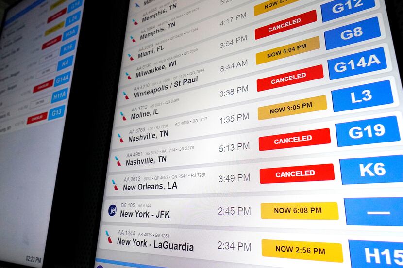 American Airlines flight information screens display flight information, including canceled...