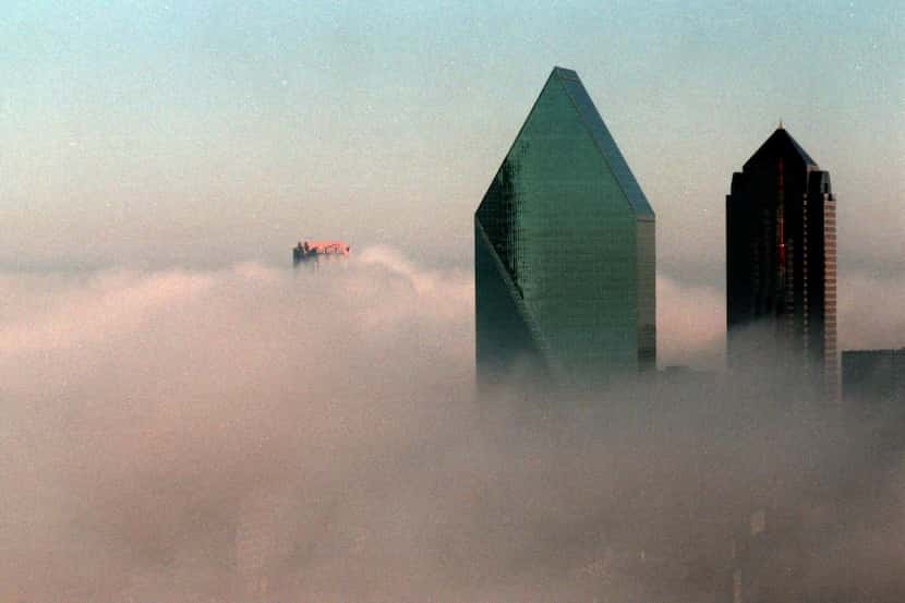 Fountain Place rises above an early morning fog in Dallas in 1988.
