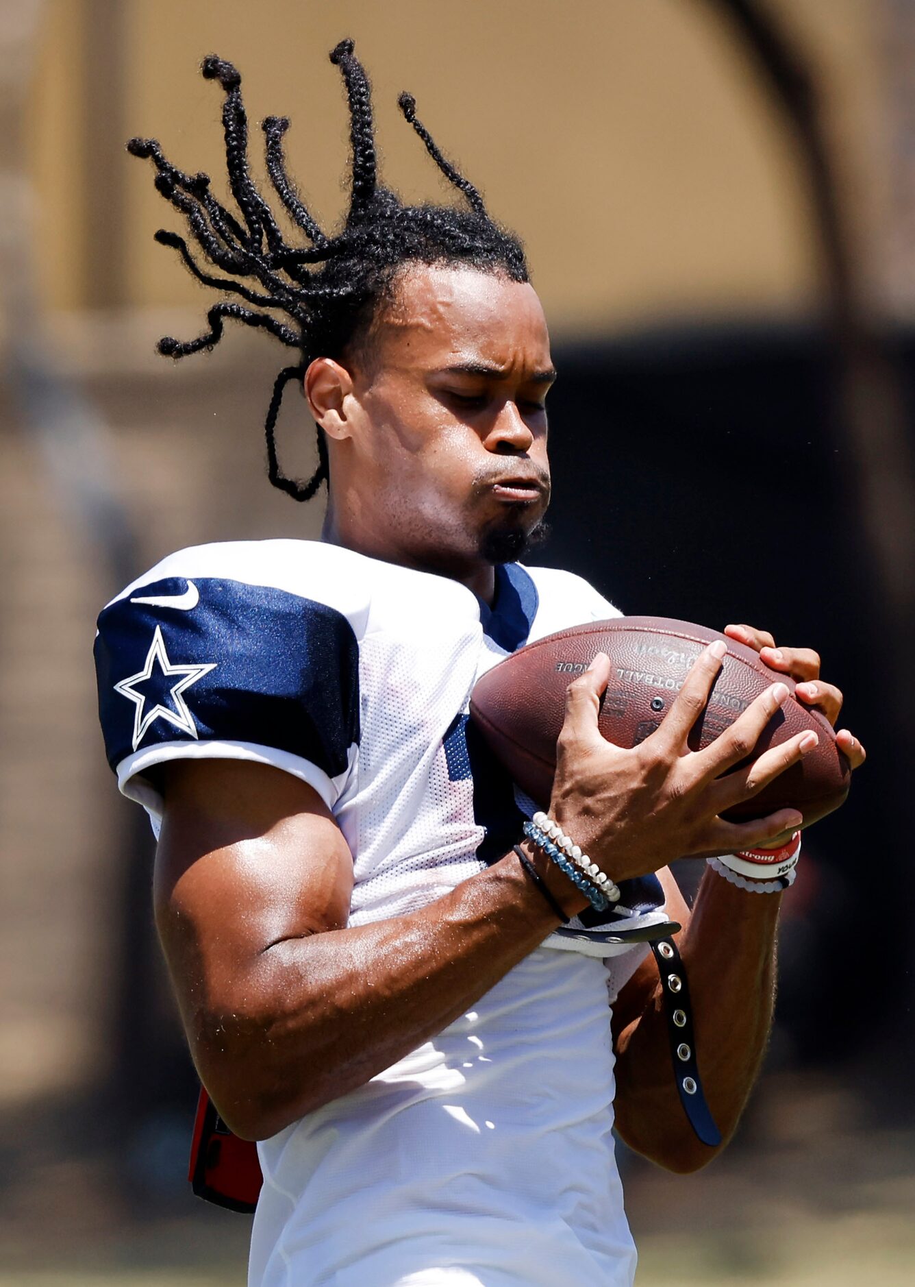 Dallas Cowboys wide receiver Jalen Tolbert (18) catches an over the shoulder soft toss...