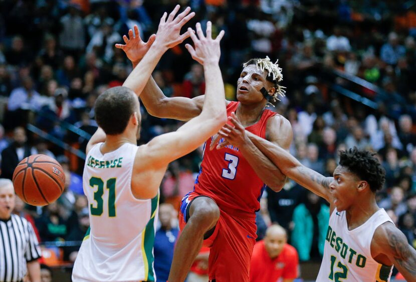 Duncanville senior guard Jahmi'us Ramsey (3) loses control of the ball as DeSoto sophomore...