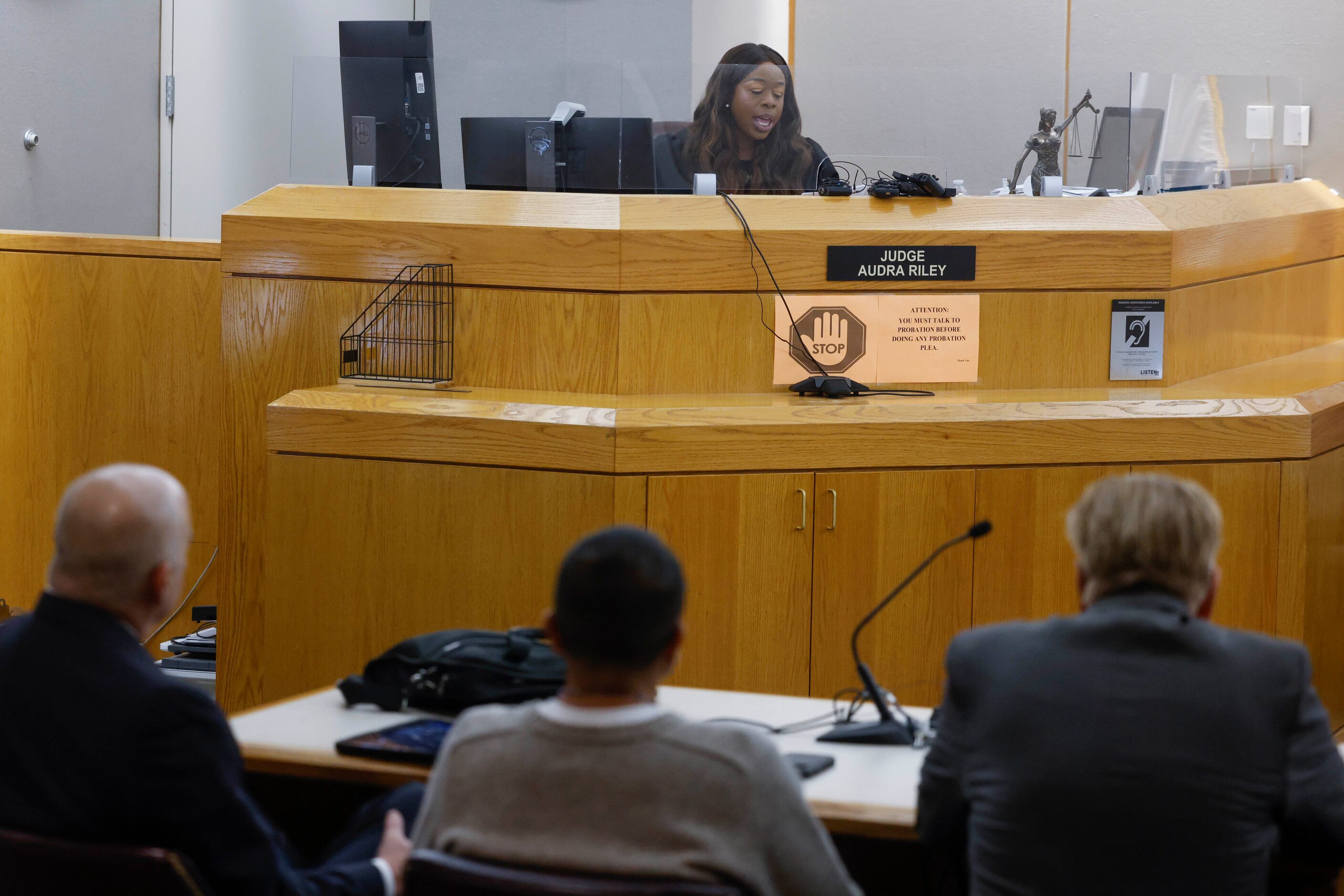 Judge Audra Riley addresses Martin Santillan (bottom, center), as he is exonerated of a 1997...