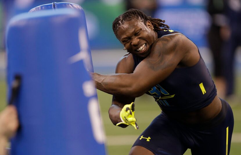 UCLA defensive end Takkarist Mckinley runs a drill at the NFL football scouting combine...